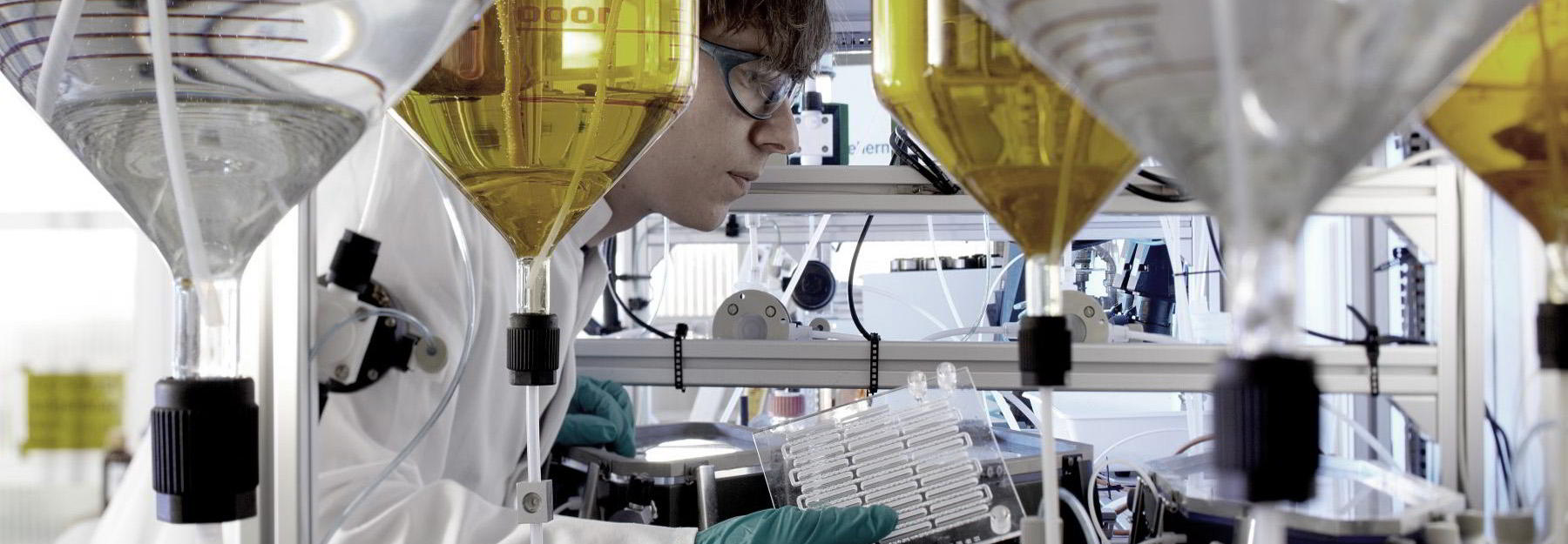 Kilogram syntheses of energetic materials in microreactors