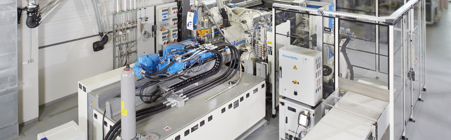Fully automated injection molding machine to process free flowing thermoset materials and thermoplastic injection molding granules