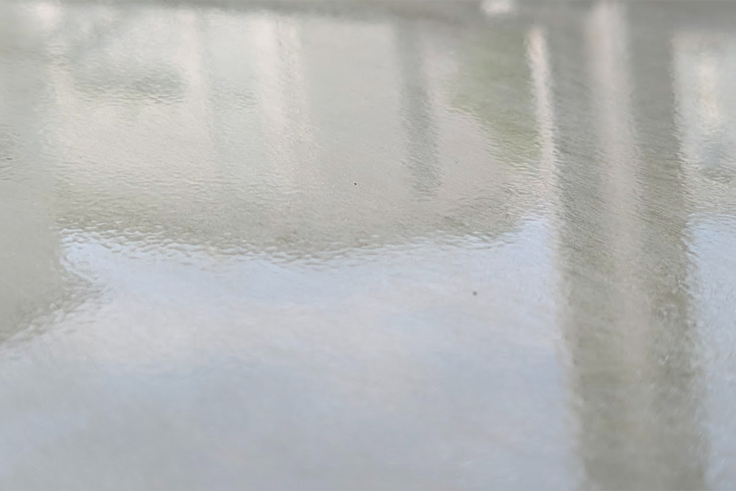 Glazed surface made of polycarbonate LFT-D with buildings reflecting. 